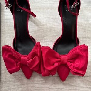 A New Day Red Heels with Dramatic Bows
